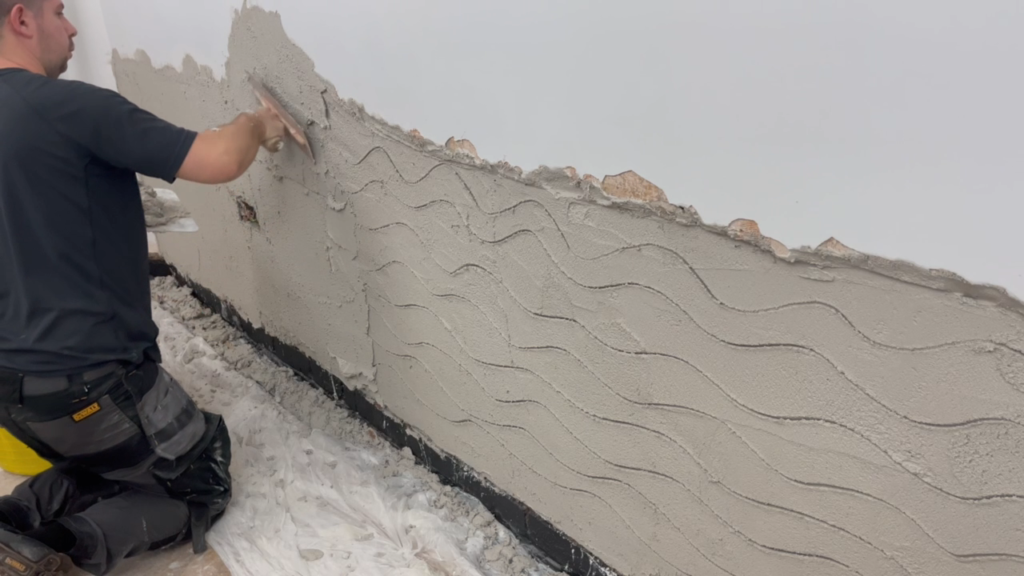 Second coat of damp resistant plaster